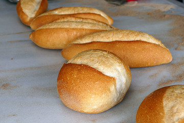 hot breads, oven and bread, freshly baked bread, baker bakes bread,