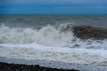 Stormy sea waves breaking near the coast