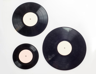 gramophone record of different sizes on a light background. View from above