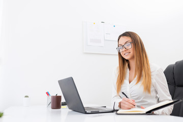 .Adorable young entrepreneur is happy about the good news for the company.