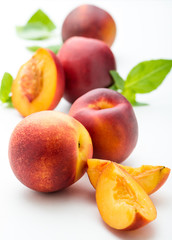 Fototapeta na wymiar fresh peaches on white