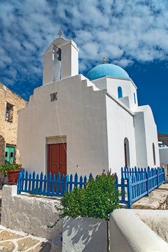 Church with bell tower in Lefkes, Greece