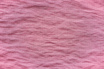 Texture of pink crumpled fabric for background