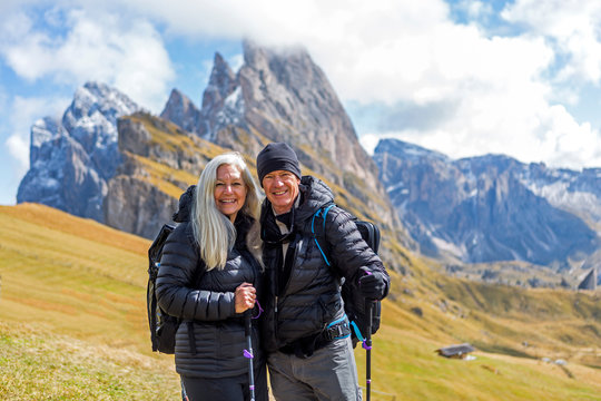 Couple hiking in the Dolomites, South Tyrol, Italy