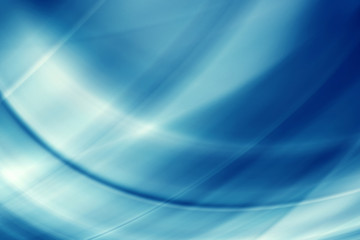 Abstract beams of light rays on a blue background