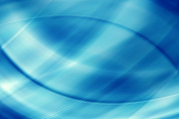 Abstract beams of light rays on a blue background