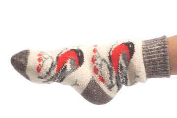 Wool socks on woman's feet isolated on white background
