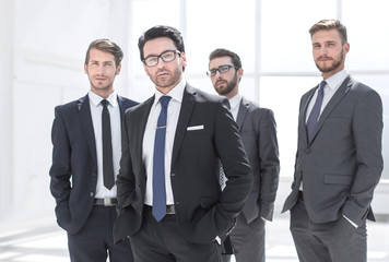 businessman and his business team standing in the office