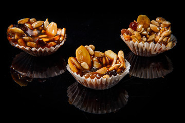 three of useful handmade candies with caramelized sunflower and pumpkin seeds