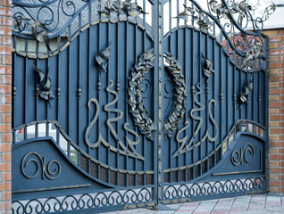 Wrought-iron gates, ornamental forging, forged elements close-up.