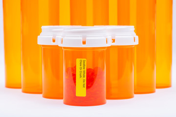 Docusate sodium soft gel capsules in orange container with SWALLOW WHOLE DO NOT CHEW OR CRUSH LABEL.