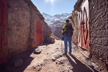 Tourist boy backpacker on the hike into the Atlas mountains in Morocco Africa