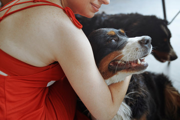 Woman petting her dogs