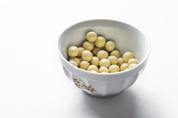 Tasty white chocolate ball in cup isolated on white background
