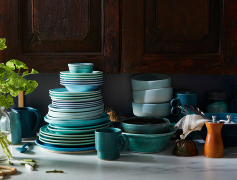 Assorted Blue Dishes in Front of Rustic Cabinet