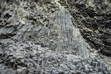 Basalt volcanic rock formations in Reinisfjara beach near Vik in northern Iceland