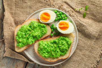 green peas, avocado and vegetable pate - sandwich (healthy breakfast). food concept. top view