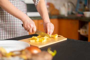 female hands cook food for the guests on holidays b