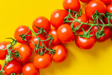 cherry tomato branch on yellow background isolated copy space design mockup b