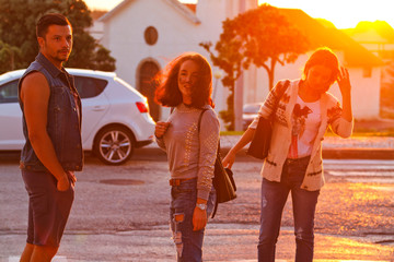 Friends walking in denim at sunset