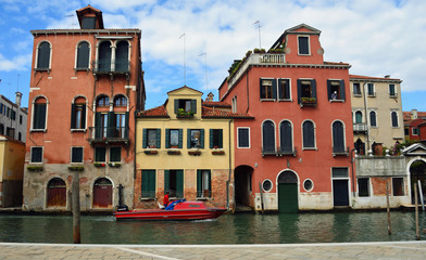 Fototapeta na wymiar Venice Canal with houses and Boat.