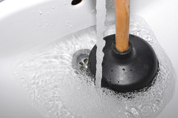 Plunger and clogged sink.