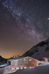 Starry night with a view of milky way galaxy over the cottage in atlas mountains Morocco Africa