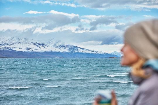 Argentina, Lago Posadas, woman holding mug at lakeside