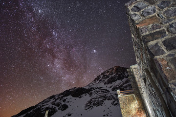 Starry night with a view of milky way galaxy next to the cottage in atlas mountains Morocco Africa