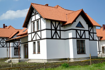 The new house in the cottage settlement. Stylization of half-timbered style
