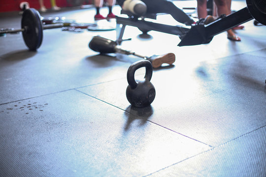 High angle view of kettlebell with artificial foot on floor in gym