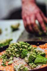Male Chef Slicing Avocado for Wedding Meal