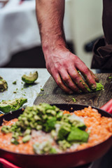 Male Chef Slicing Avocado for Wedding Meal