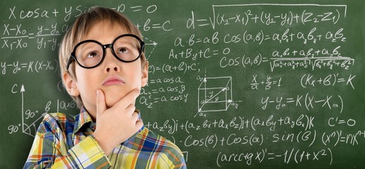 Portrait of a cute young boy with glasses isolated on  background. Studio shot.