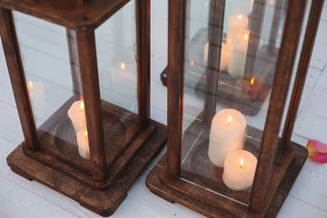 Wooden candlesticks with white candles