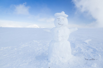 Snowman in the white winter landcape of Krkonose