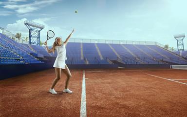 Tennis girl on a professional tennis court.