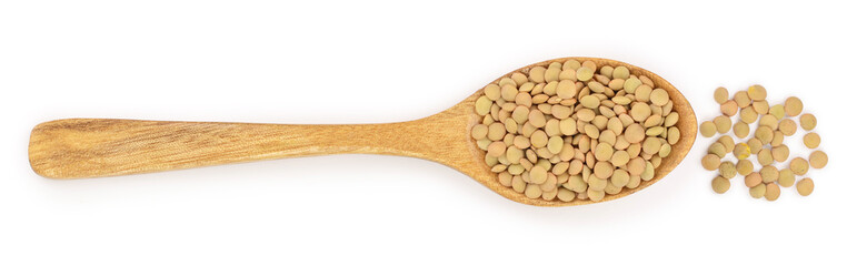 green lentil in wooden spoon isolated on white background. Top view