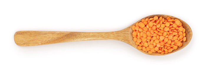 red lentil in wooden spoon isolated on white background. Top view