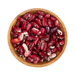 variegated kidney bean in wooden bowl isolated on white background. Top view. Flat lay