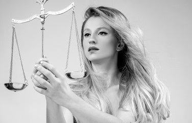 Beautiful woman with scales. Femida. Libra Zodiac Sign