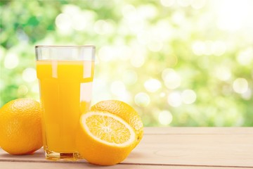 Orange juice and slices of orange on background