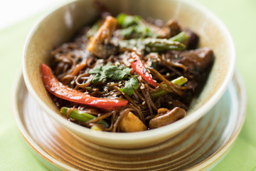 Asian food in the plate, buckwheat soba with vegetables