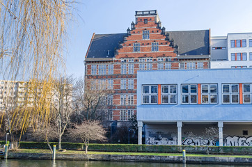 Spree river embankment  Holsteiner Ufer with buildings of a  Gymnasium school in Berlin, Germany