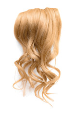 Obraz premium Long wavy blond hair isolated on white background