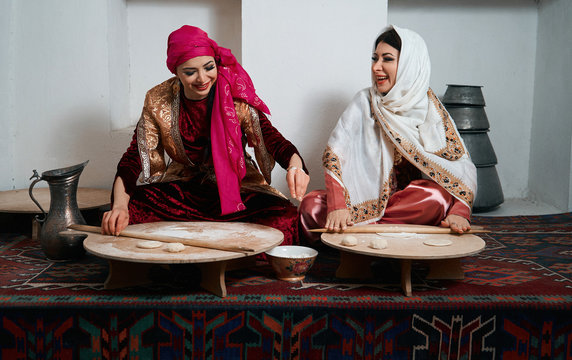 Woman preparing or making borek or bread dough, close-up