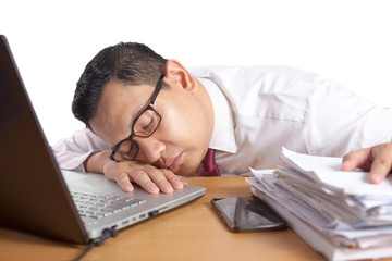 Tired Sleepy Asian Businessman Having Overworked