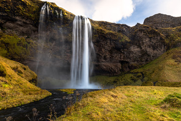 Beautiful Seljalandsfoss waterfall in Iceland on a Sunny Fall Day