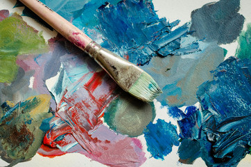 Artist paint brush on the wooden palette