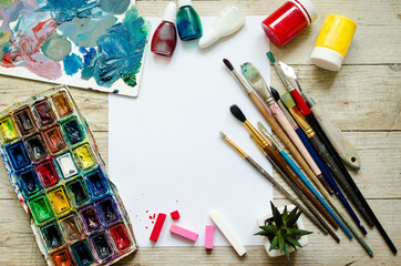 Creative artist workplace flat lay, mockup on wooden background